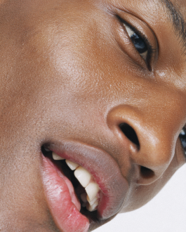 Close-up portrait exploring expression and skin texture, captured through contemporary photography and experimental visual art by IMPROMPTU studio. 