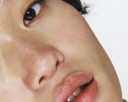 Close-up portrait exploring expression and skin texture, captured through contemporary photography and experimental visual art by IMPROMPTU studio. 